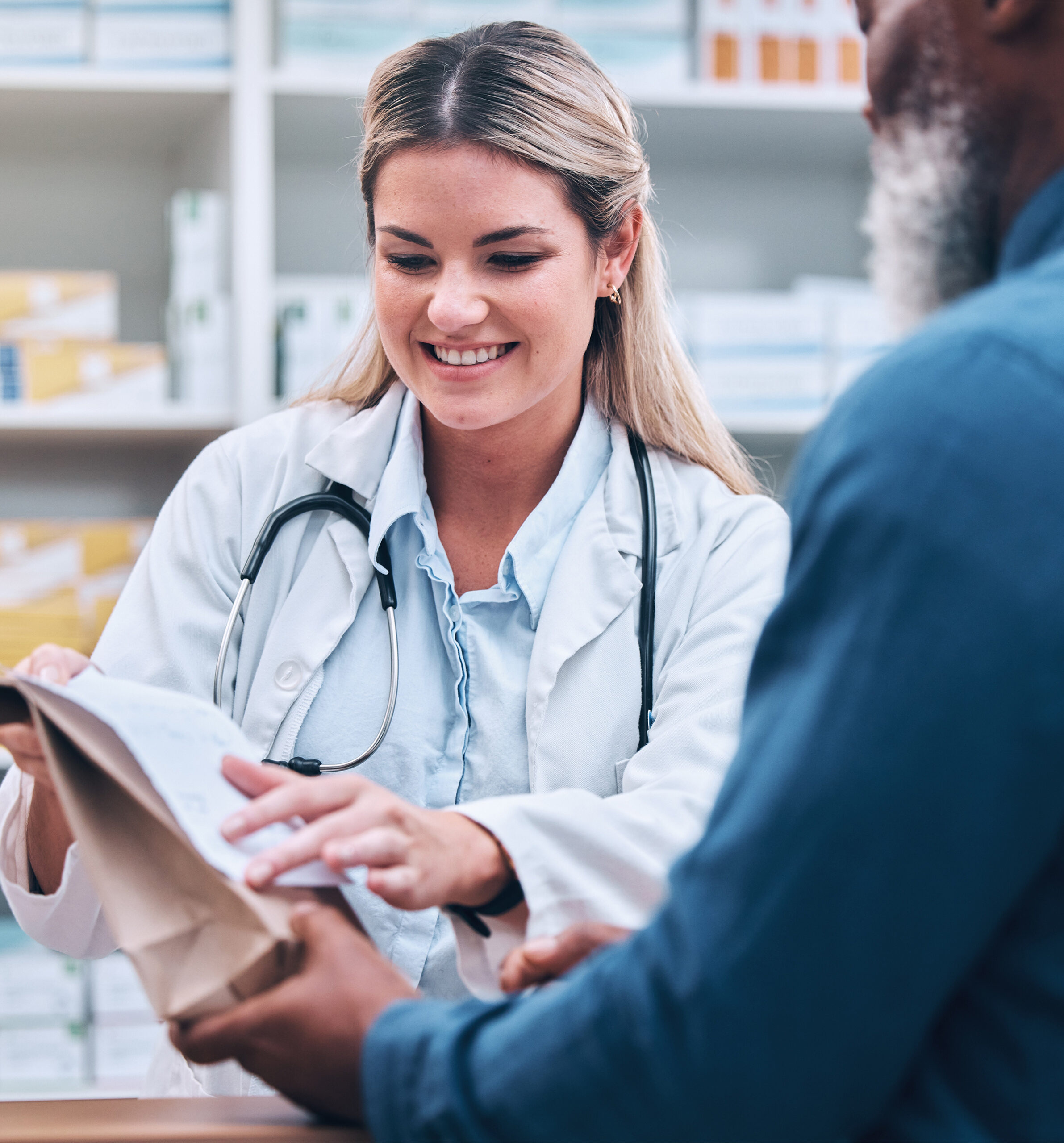 Healthcare, Pharmacist and Man at Counter, Medicine, Prescription Drugs and Happy Service at Drug Store